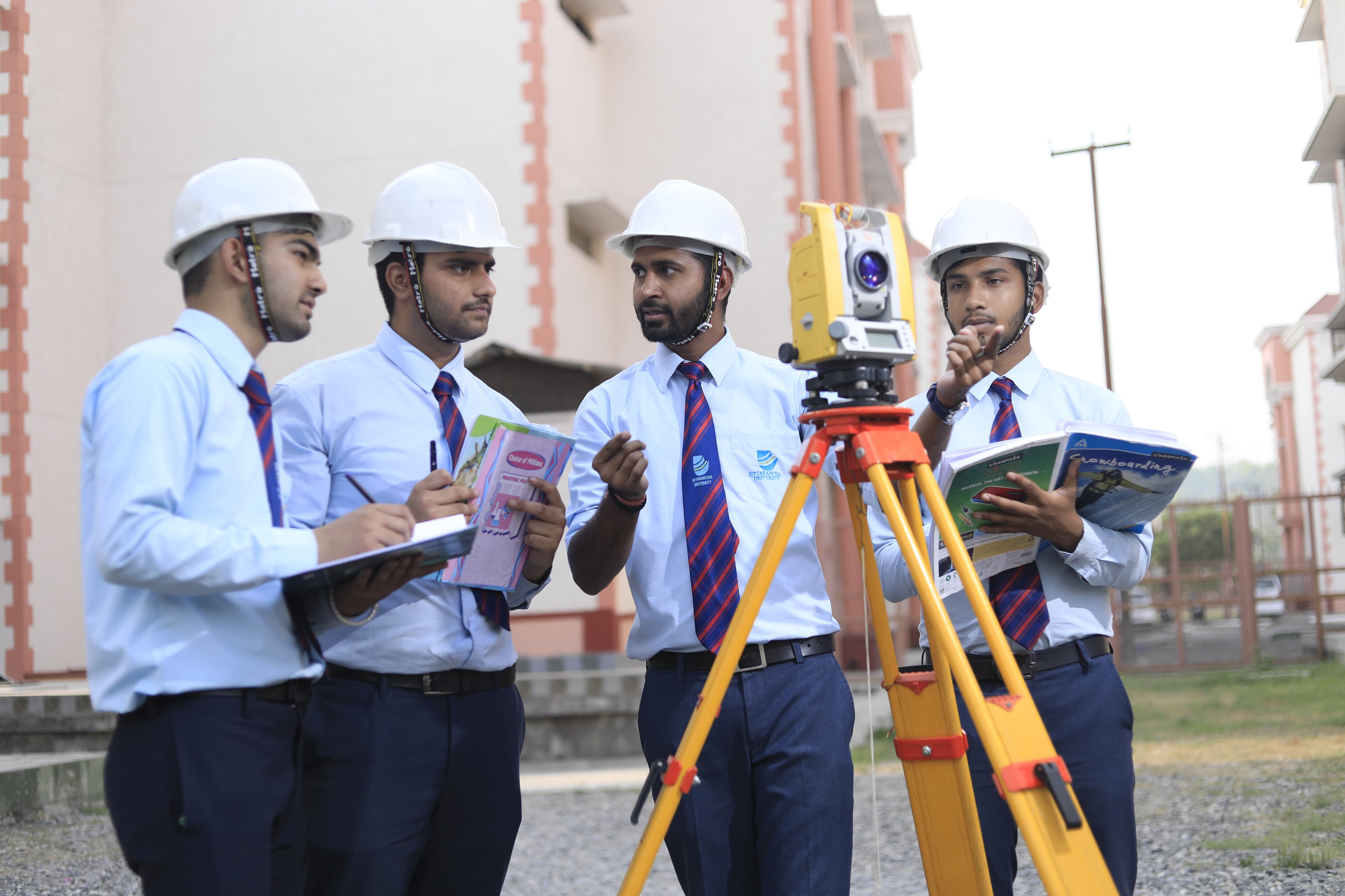 Students in surveying practical session at Uttaranchal University