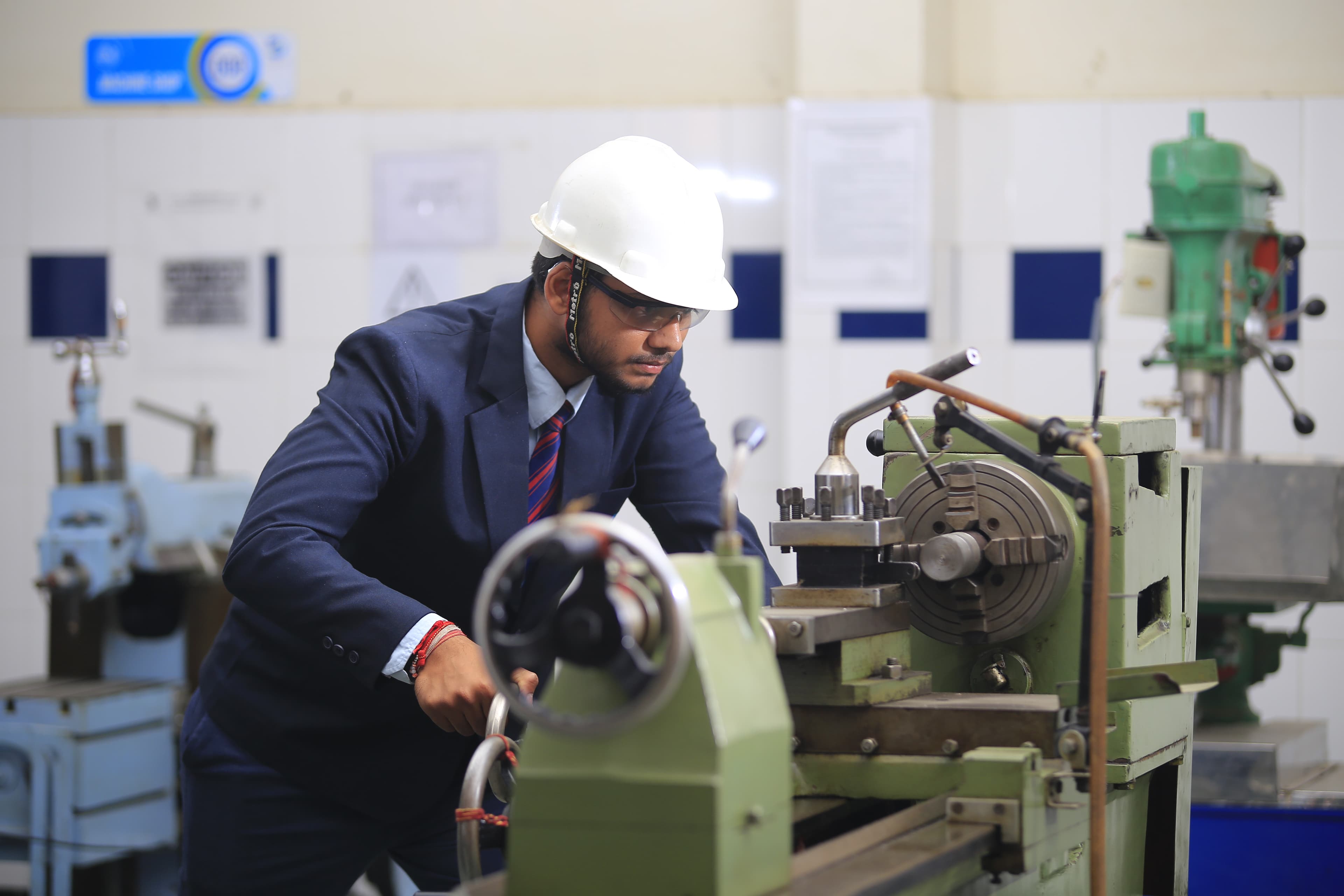 Student performing practical training in mechanical workshop